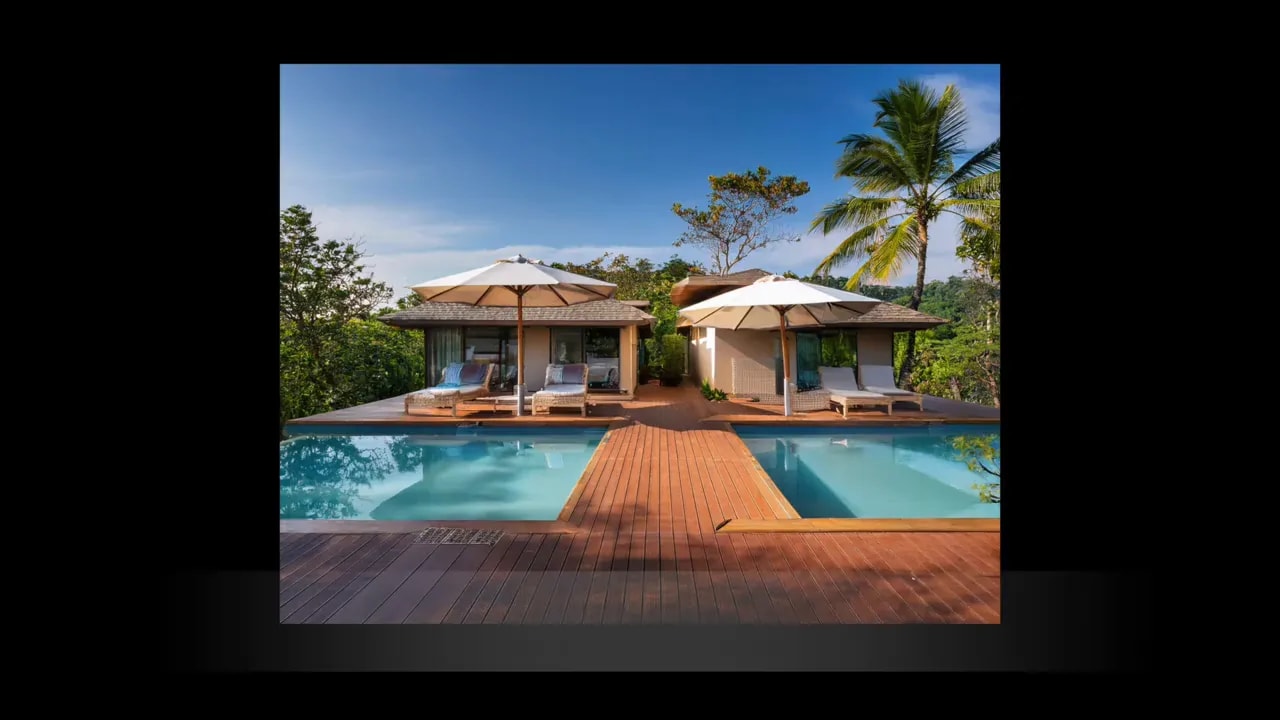 Villa with central walkway leading to a pool and text identifying Airbnb villas