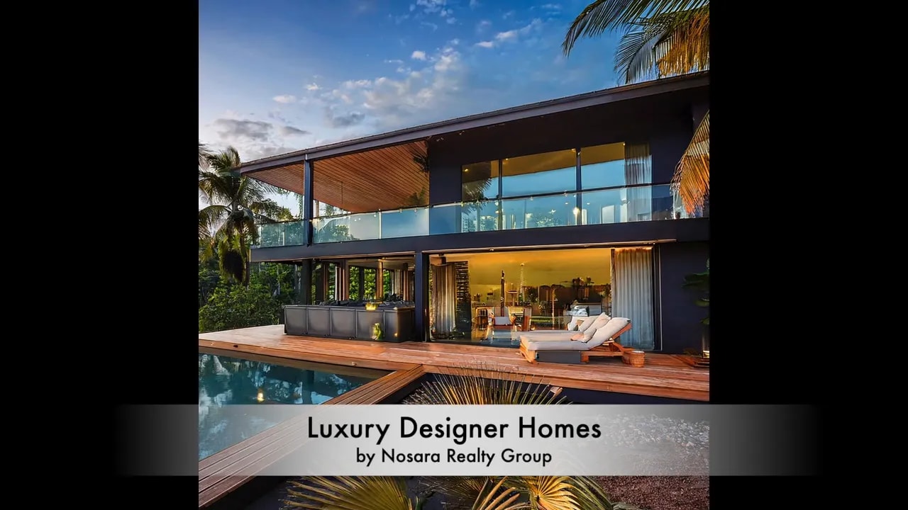 Large modern glass home with text identifying luxury designer homes