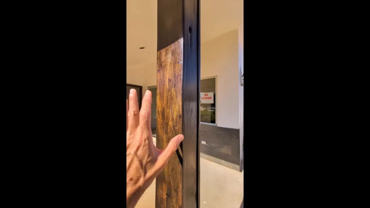 Close view of varnished wood patio column with glossy finish